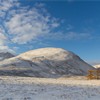 Derelict barn and mountain scenery in winter, Highlands, Scotland, UK